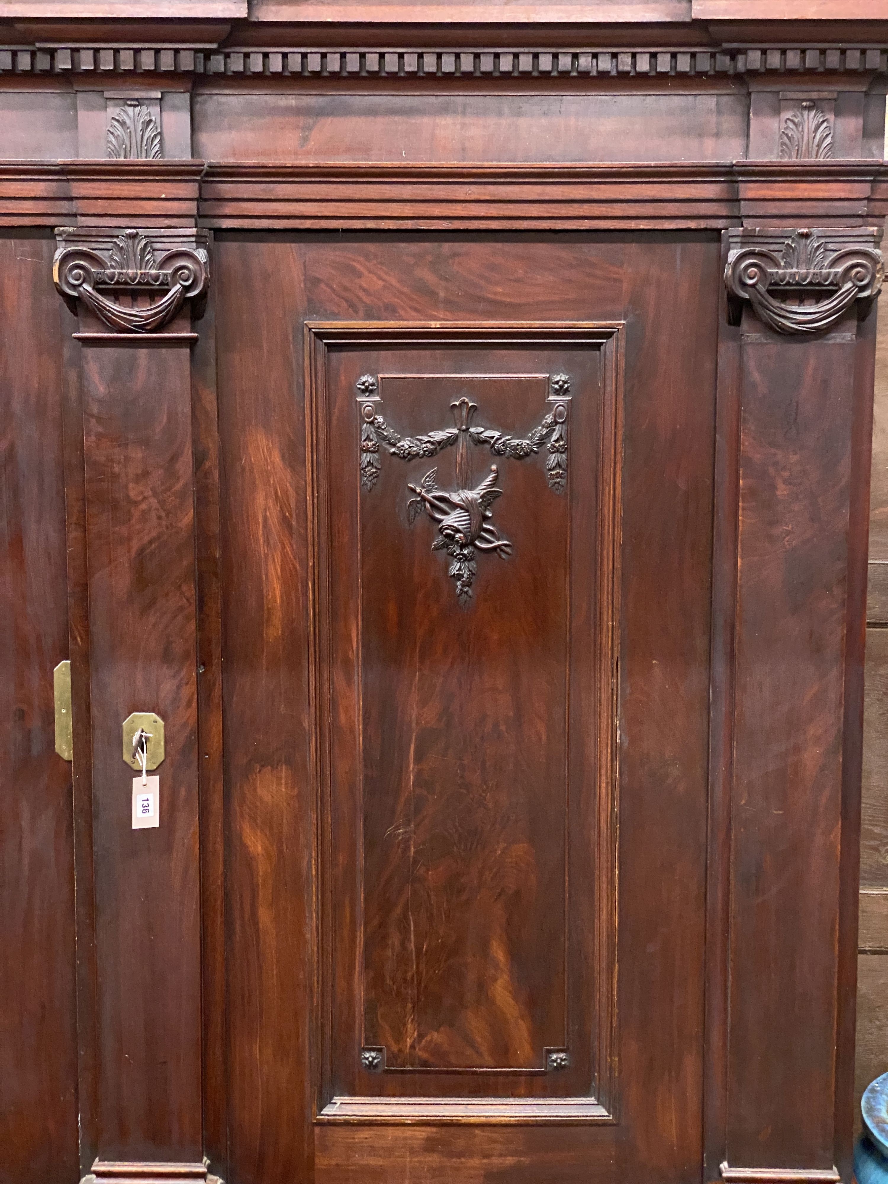 An 18th century carved walnut shrank, length 220cm, depth 73cm, height 216cm